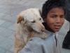 Street kid with his dog